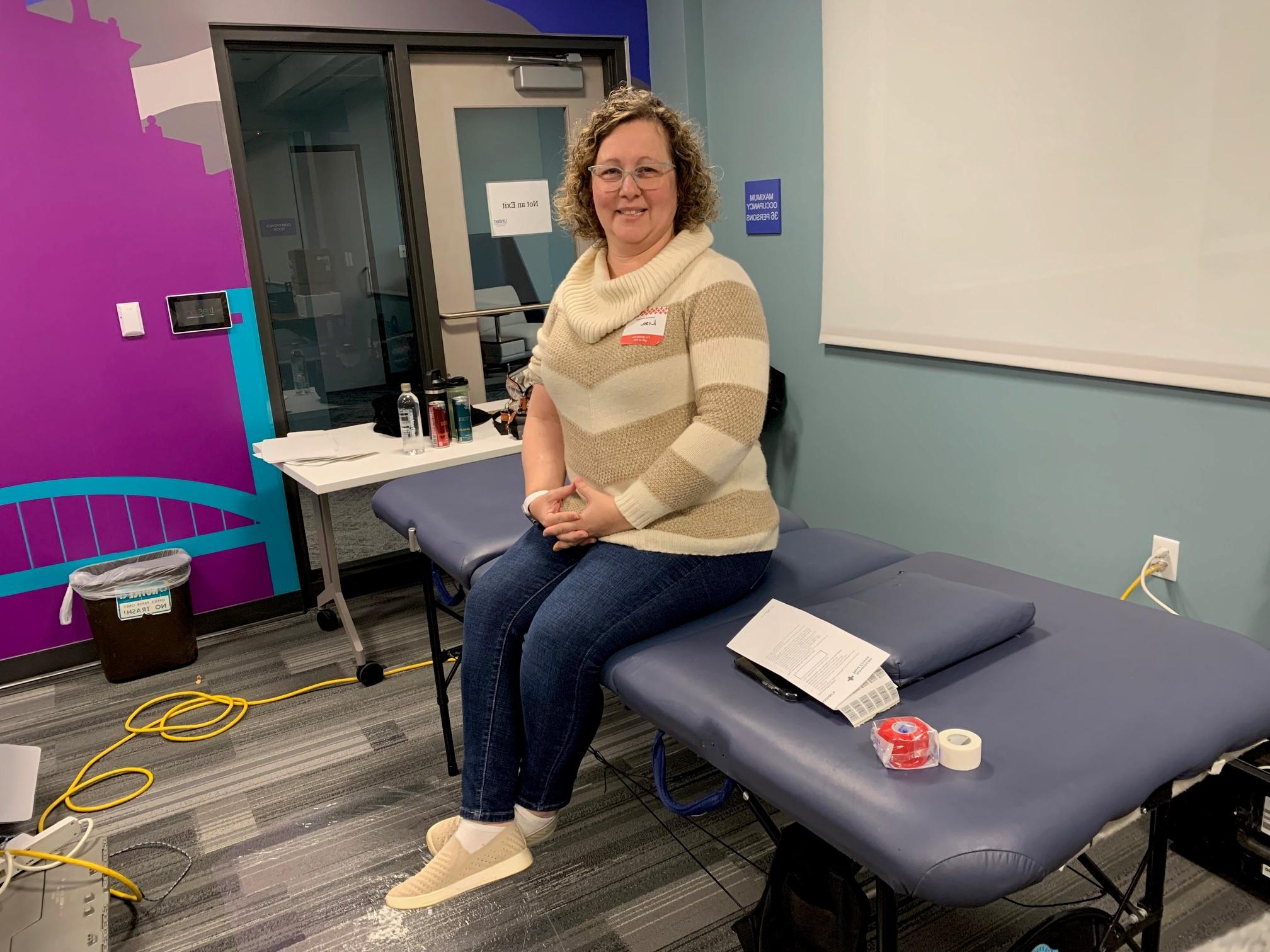 United employee, Lisa DeRosa, prepares to donate blood